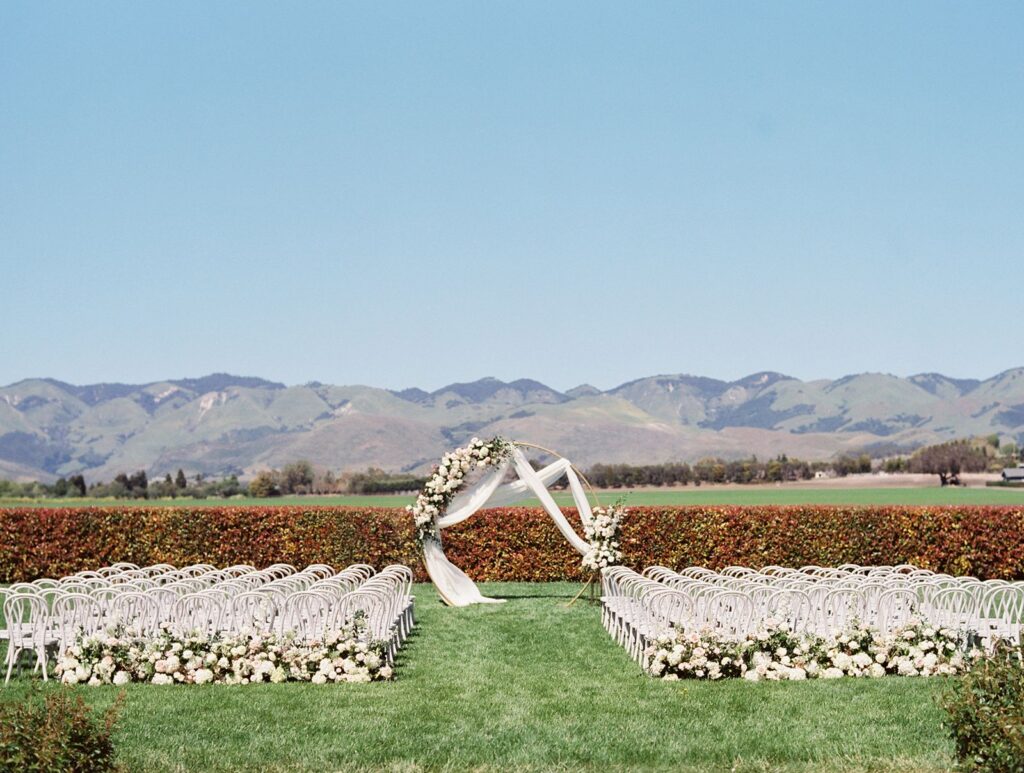 The White Barn wedding ceremony on lawn