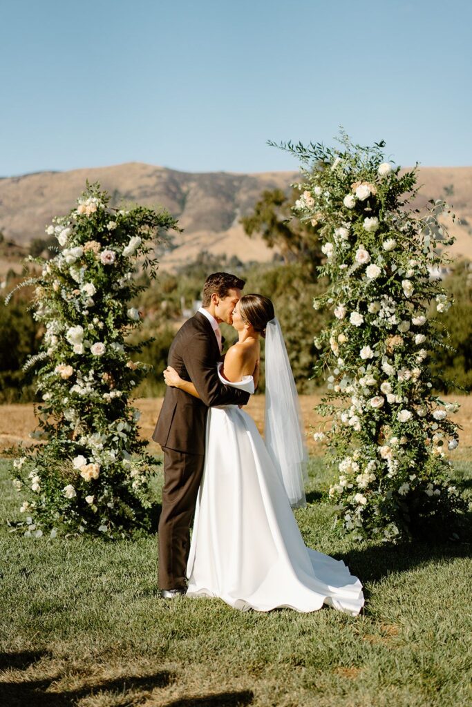 Bride and Groom kissing at wedding ceremony