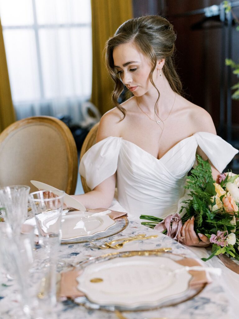 bride looking down at wedding table